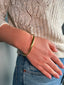 Babette Resouir - gouden 'twisted' armband